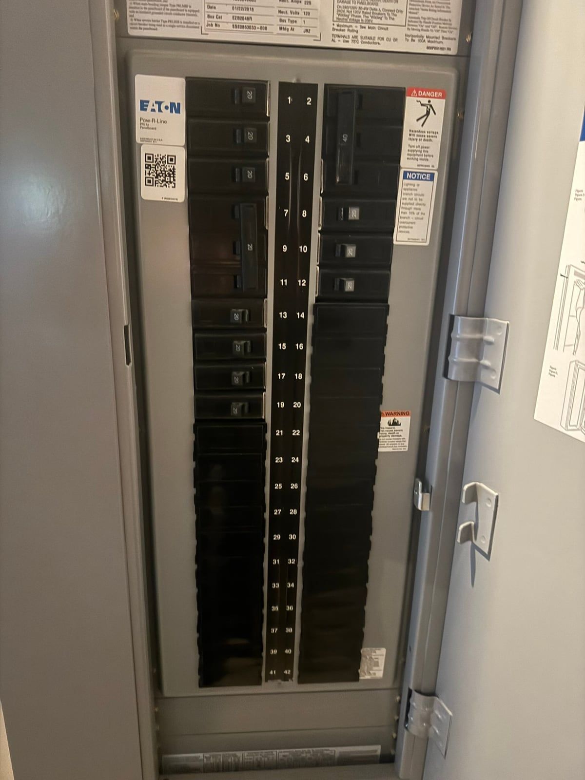 Eaton Pow-R-Line commercial panelboard installed by Sound Electric, door open with the deadfront on and 42 numbered circuit spaces